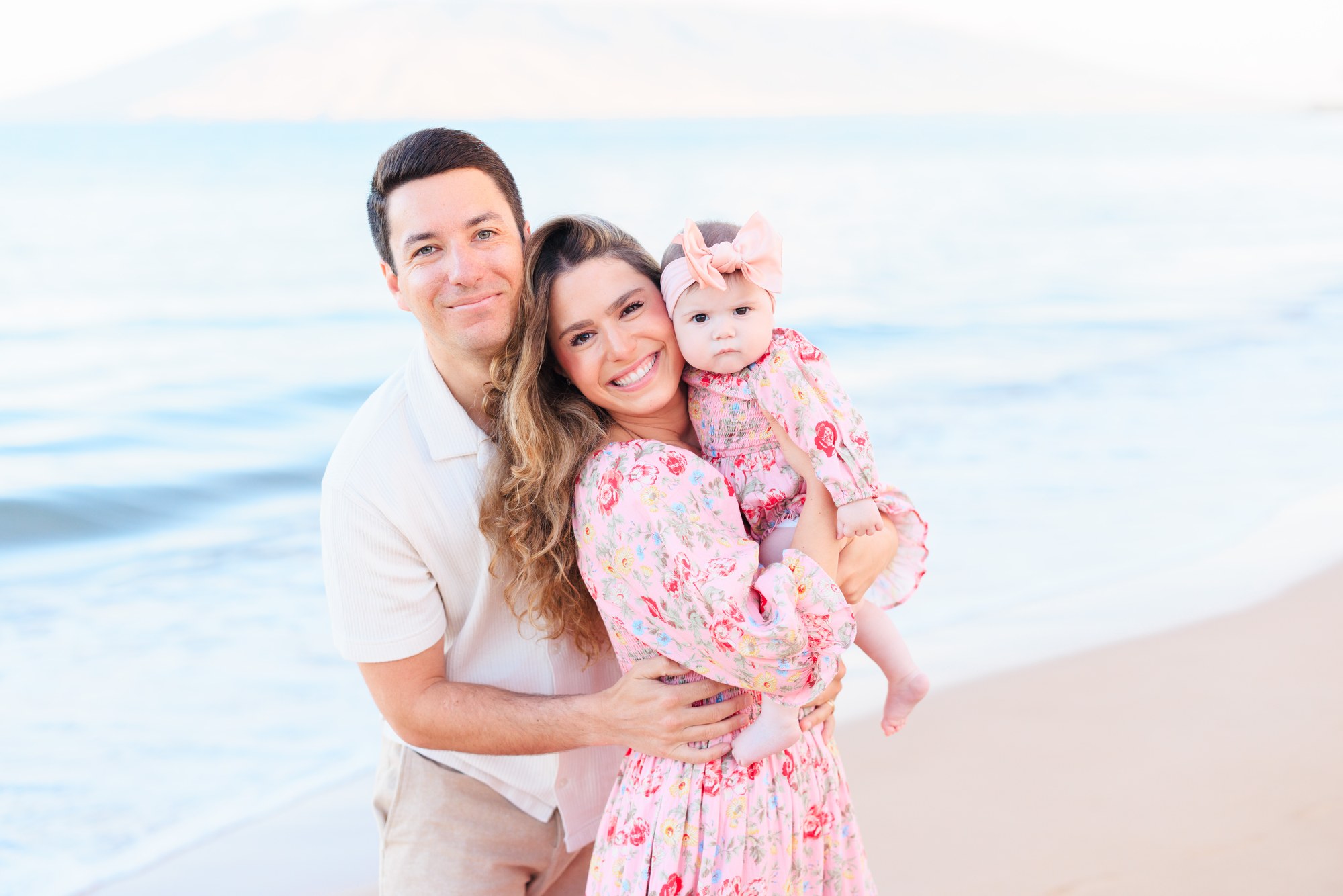 A family of three during a bright, soft morning session in Wailea